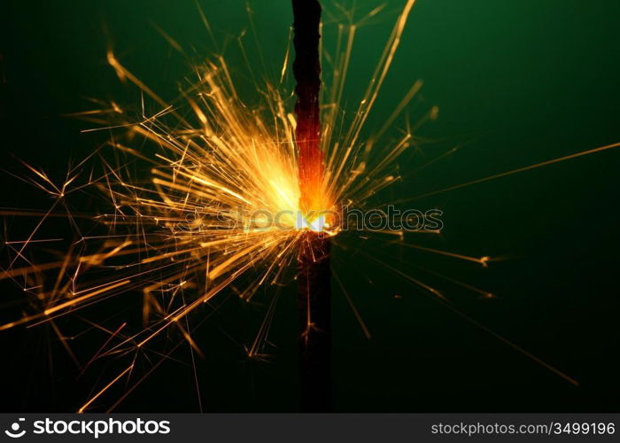 christmas sparkler on green background