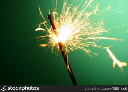 christmas sparkler on green background