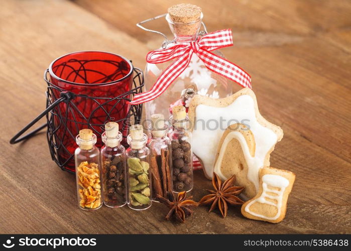 Christmas spices for mulled wine or ginger cookies in small decorative bottles