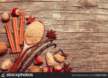 Christmas spices on wooden background with copy space for design. The Christmas spices