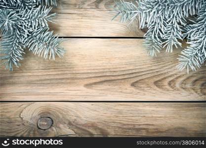 Christmas spruce tree covered with snow for holiday background. Copy space. Top view