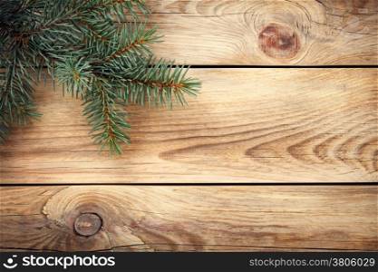 Christmas spruce tree on wooden table for holiday background. Copy space. Top view&#xA;