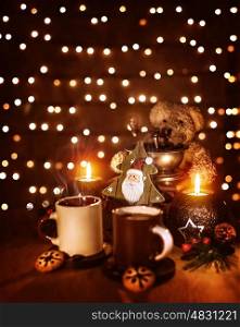 Christmas still life on the table at home, mugs with coffee and cookies, decorative Christmas tree, teddy bear, festive glowing background
