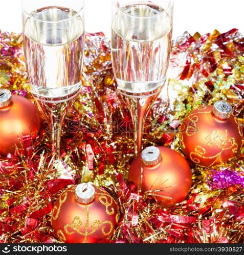 Christmas still life - Two glasses of champagne with orange Xmas decorations on white background
