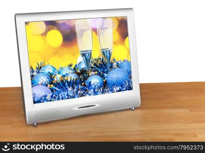 Christmas still life with blue balls and glasses on screen of TV set isolated on white background