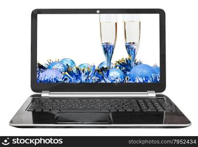 Christmas still life with blue baubles and glasses on laptop isolated on white background