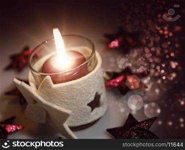 Christmas still life with candle and beauty bokeh
