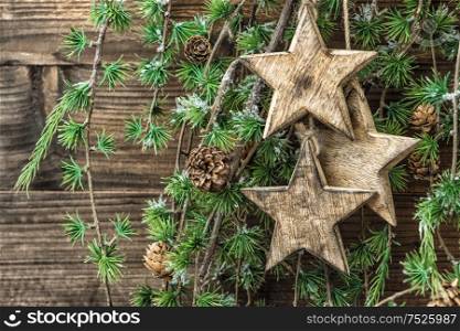 Christmas still life wooden ornaments and pine tree branches. Holidays background. Retro style decorations
