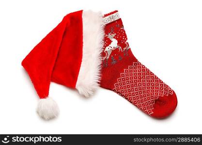 Christmas stocking and Santa hat isolated on white
