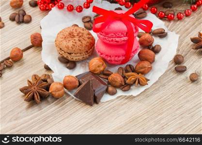 christmas strawberry and chocolate macaroons  on wooden table