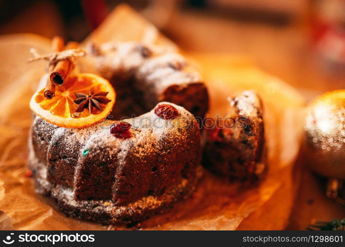 Christmas sweet cookie with holiday decoration closeup. Xmas traditional symbol, festive food, fir tree branch. Christmas cookie with holiday decoration closeup