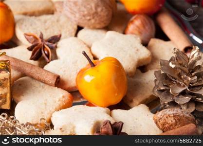 Christmas sweet decor - cookies, apple and spices on the tray