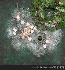 Christmas sweet food star cookies, cake Stollen, coffee and decoration. Holidays background turquoise stone