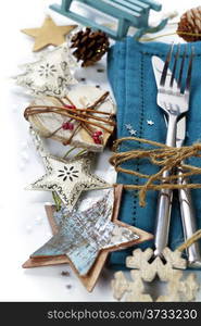 Christmas table place setting with christmas decorations