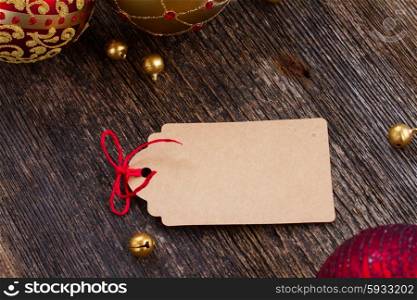 christmas tag . empty tag with red bow in frame of christmas decorations