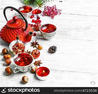 Christmas tea with cranberry. Cranberry tea in stylish cups at the Christmas background.Copy space