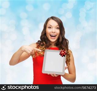 christmas, technology, present and people concept - smiling woman in red dress with blank tablet pc computer screen over blue lights background