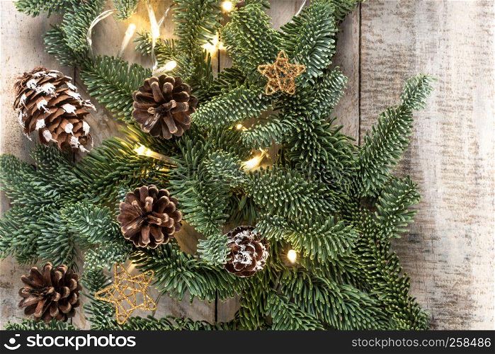 Christmas theme background in vintage tone. Rustic wood background for Christmas with copy space for all Christmas design. Pine branch. Top view. Flat layer