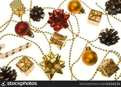 christmas things as ctrobiles and gold and red present and balls isolated on white