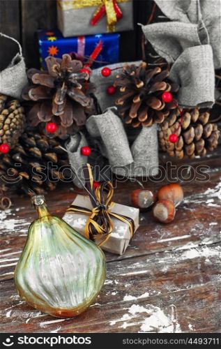 Christmas toy and Christmas wreat. Christmas toy on the background of the Christmas wreath with pine cones