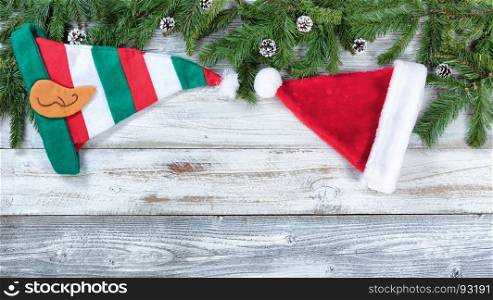 Christmas traditional hat decorations on rustic wood in flat lay format