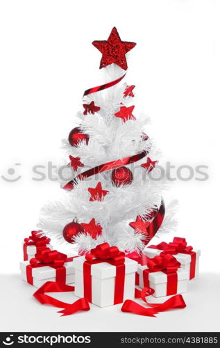 Christmas tree and gifts isolated on white background