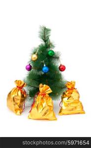 Christmas tree and golden sacks on white