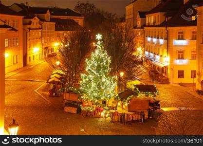 Christmas tree and holiday decorations in the Old Town in the magical city of Prague at night, Czech Republic