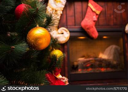 Christmas tree and in the interior with a fireplace