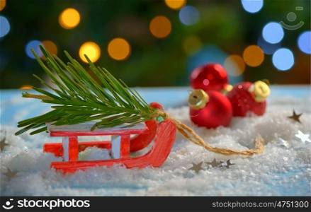 Christmas tree and sleigh decoration on fake snow