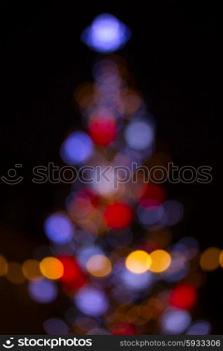 christmas tree blue, red, orange lights bokeh defocused background