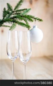 Christmas tree branch with empty champagne glasses