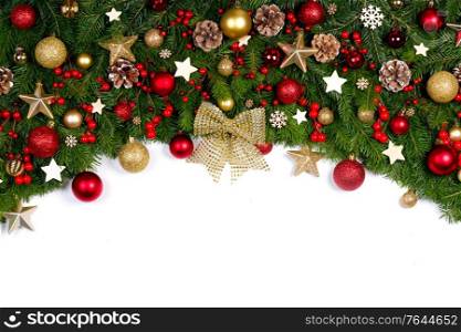 Christmas tree branches and decoration baubles isolated on white background as a border or template for christmas card. Christmas decoration frame on white