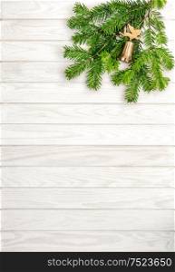 Christmas tree branches on white wooden background. Undecorated evergreen twigs