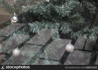 Christmas tree decor on the window of a wooden house, stock photo
