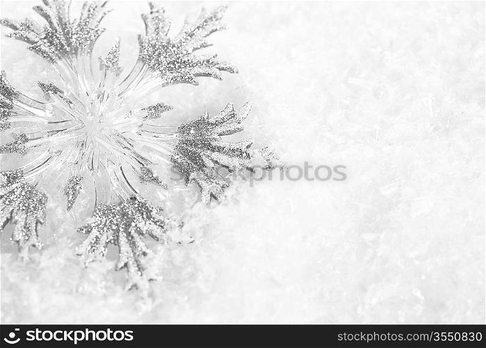 Christmas tree decoration on snow. Abstract background, shallow depth of fields