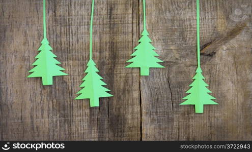 Christmas tree decoration on wood textured background.