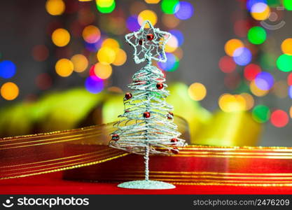 Christmas tree decoration ornament isolated on blurred background of lights