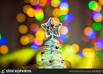 Christmas tree decoration ornament isolated on blurred background of lights