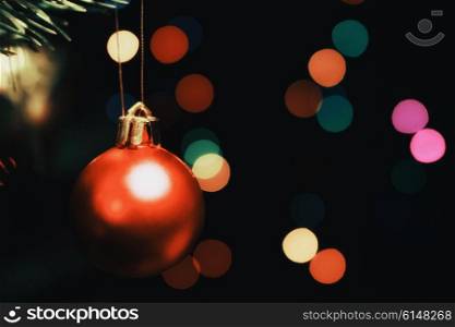 Christmas tree decorations against the backdrop of colorful blurred spots