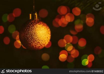 Christmas tree decorations against the backdrop of colorful blurred spots