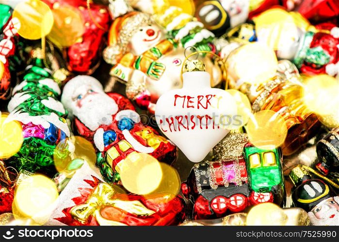 Christmas tree decorations baubles, toys and colorful ornaments. Vibrant colors with lights effect