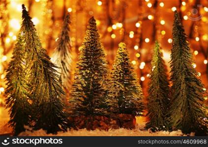 Christmas tree forest, holiday background with winter ornament &amp; abstract defocus lights decoration