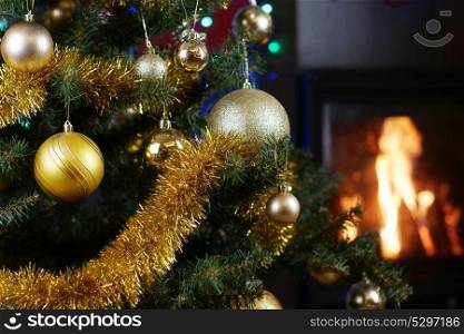 Christmas tree in interior with fireplace