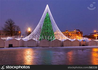 Christmas tree in Vilnius, Lithuania. Decorated and illuminated Christmas tree on the Cathedral Square at night, Vilnius, Lithuania, Baltic states.