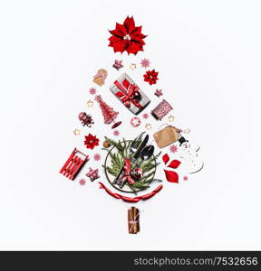 Christmas tree made with various Christmas objects on white background