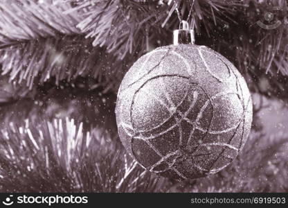 Christmas tree on a branch, snow. Vintage processing