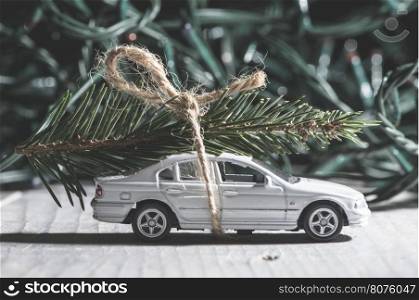 Christmas tree on car. Small toy car