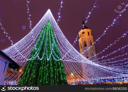 Christmas tree on the Cathedral Square and Cathedral Belfry, Vilnius, Lithuania, Baltic states.. Christmas tree in Vilnius, Lithuania