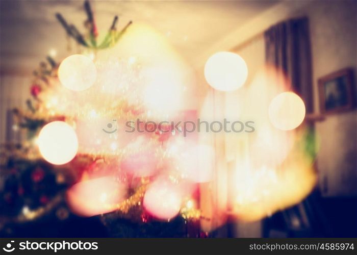 Christmas tree scene in living room with festive bokeh, blurred holiday background